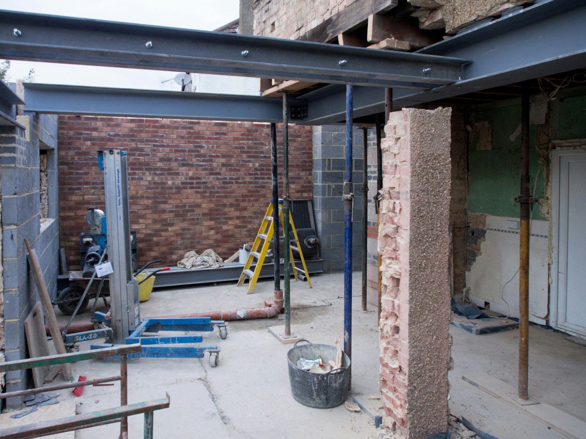 Steel beam installed across a new rear opening in a London house